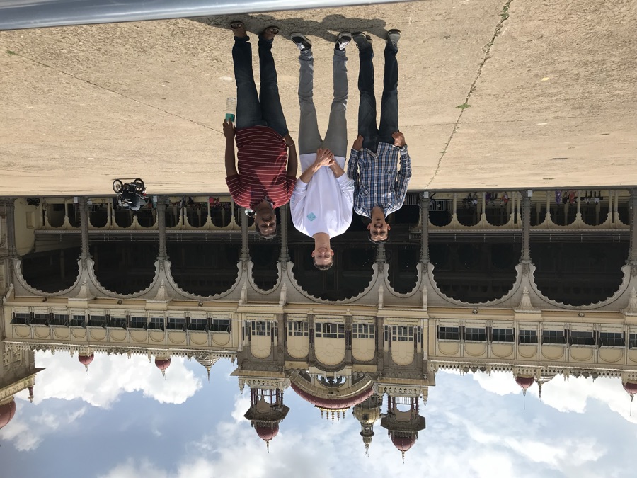 Three friends in front of Mysore Palace in India