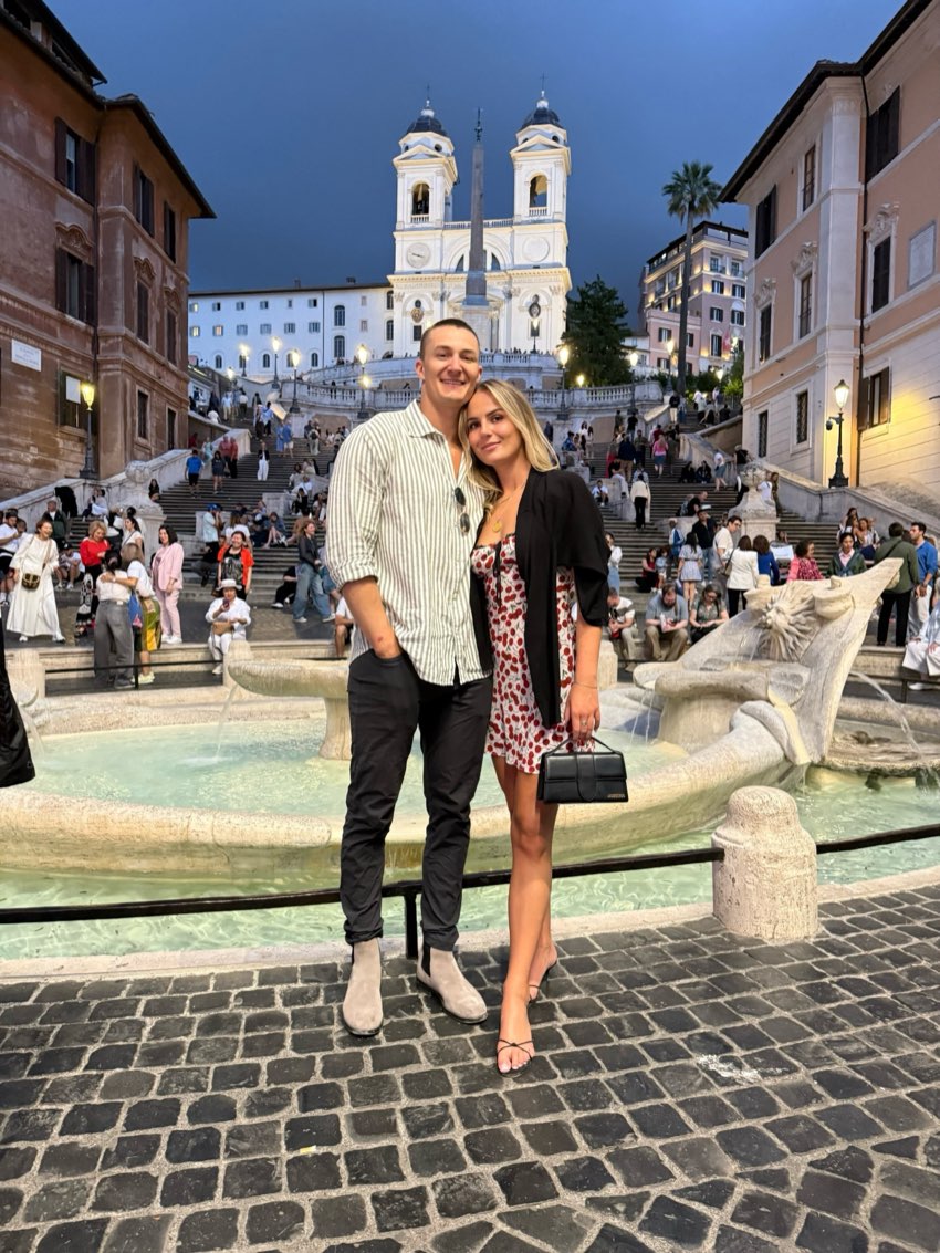A couple at the Spanish Steps and Barcaccia fountain in Rome at dusk