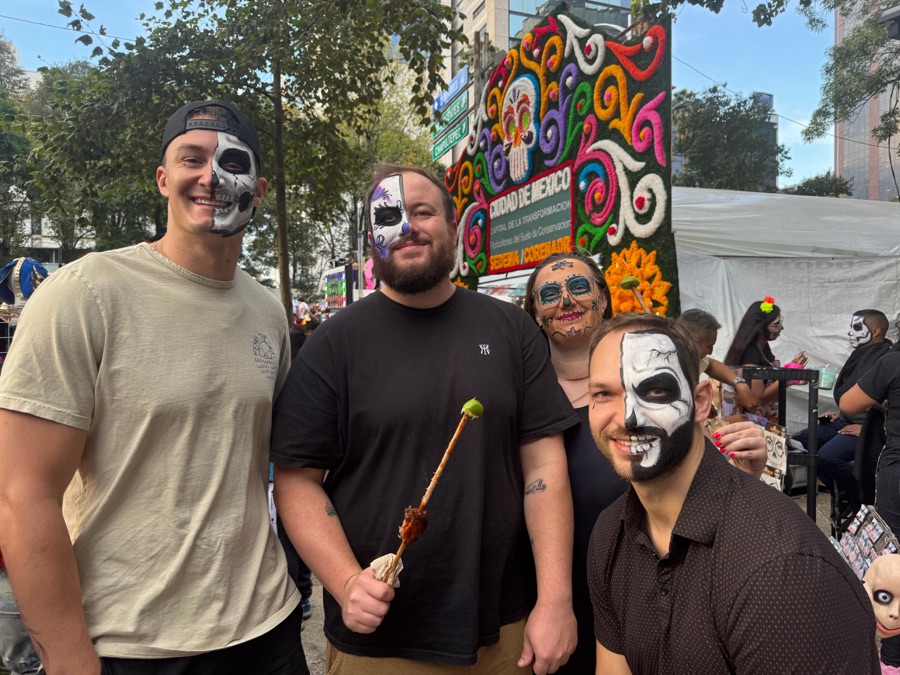 In Día de los Muertos face paint at a festival in Mexico City