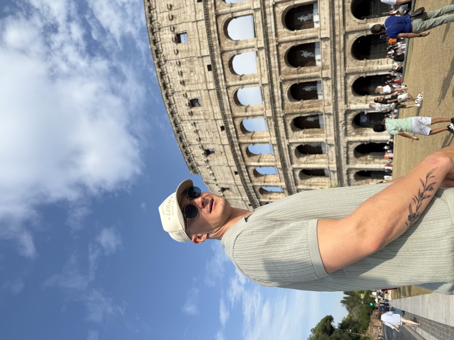 Standing in front of the Colosseum in Rome